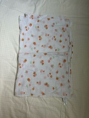Nordstrom White Muslin Baby Swaddle with Orange and Green Floral Motif